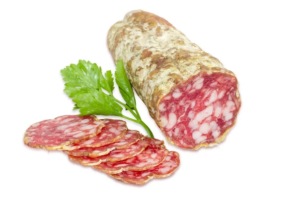 Salami and sprig of parsley  on a light background — 图库照片