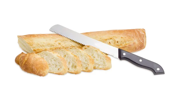 Baguette and bread knife on a light background — Stock Photo, Image