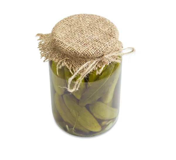 Pickled cucumbers in glass jar on a light background — 스톡 사진