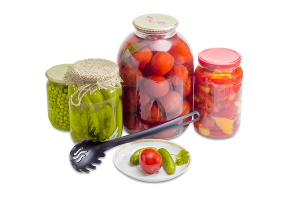 Pickled vegetables on saucer and in glass jars — 스톡 사진