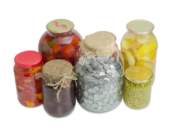 Jar with coins among home canned fruit and canned vegetable — 스톡 사진