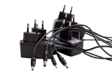 Battery chargers for various gadgets on a light background