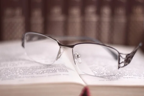 Glasses on open book — Stock Photo, Image