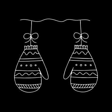 Siyah arka planda izole edilmiş bir çift beyaz örgü eldiven resmi dekorasyon için noel toplarına benziyor.