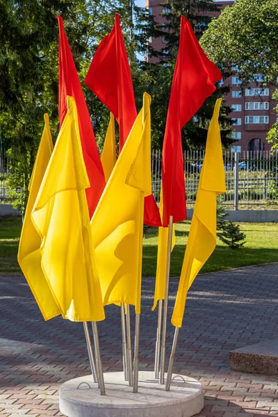 Group Beautiful Yellow Red Flags Sunny Summer Day Vertical — Stock Photo, Image