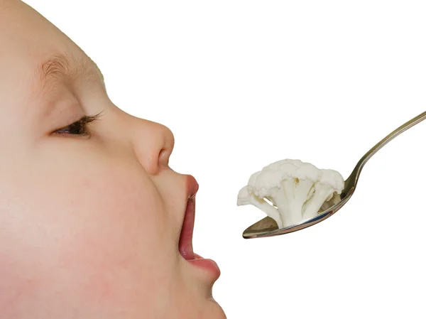 A criança come mingau — Fotografia de Stock