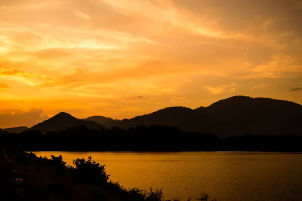 Silhouette Mountain Attractive Background Sunset Vivid Yellow Sky Lake — Stock Photo, Image