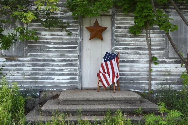 American flag by old house door — Stock Photo, Image