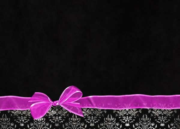 Bright pink bow on damask border — Stock Photo, Image