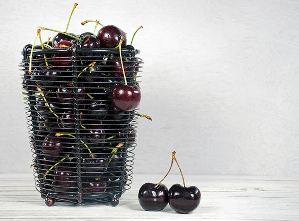 cherries in a wire basket