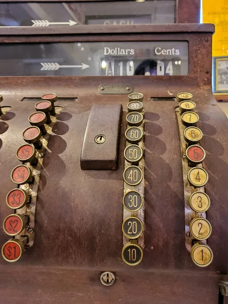close up of antique cash register in store