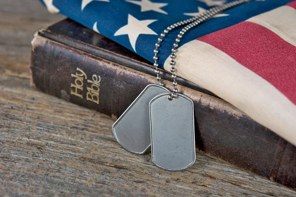 Dog tags on Bible — Stock Photo, Image