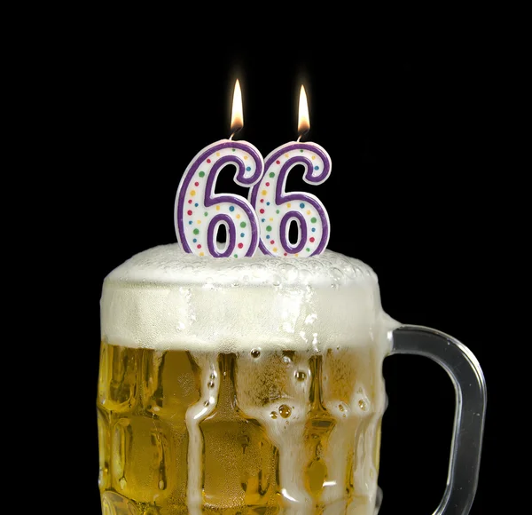 Candles in beer for 66th birthday — Stockfoto