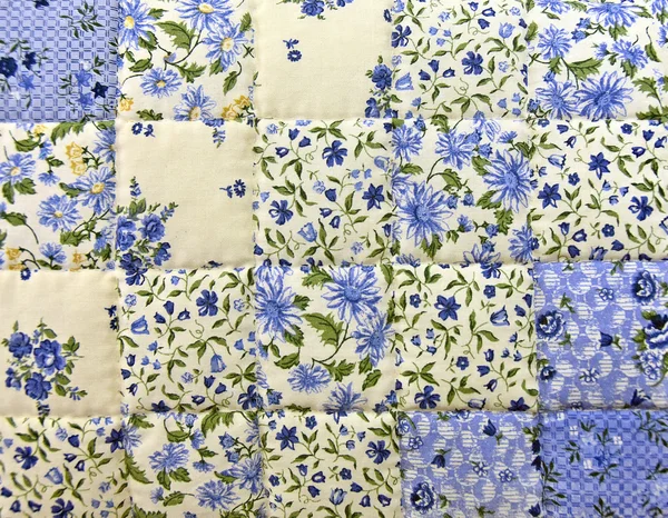 Blue floral patchwork quilt macro — Stock Photo, Image