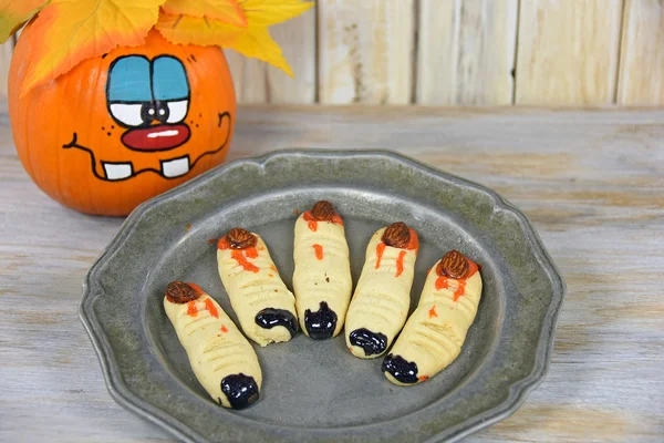 Halloween finger cookies with fun pumpkin — Stock Photo, Image