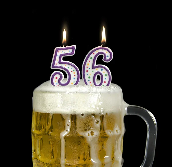 Candles in beer for 56th birthday — Stock Photo, Image