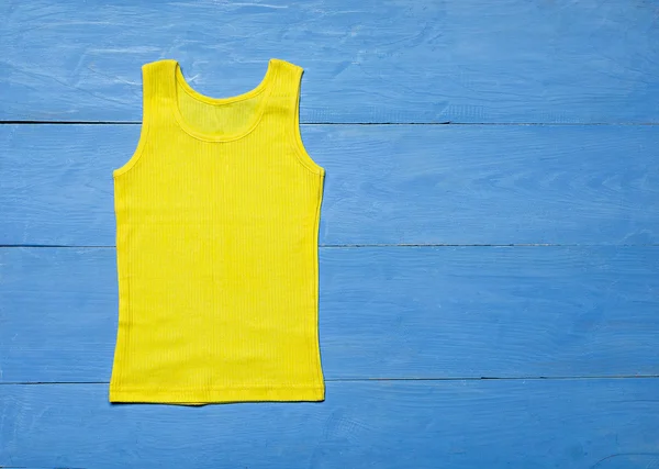 T-shirt on wooden background — Stock Photo, Image