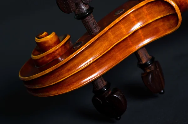 Wooden violin head Stock Photo