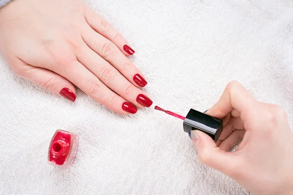 Manicured nails with red nail polish Stock Image