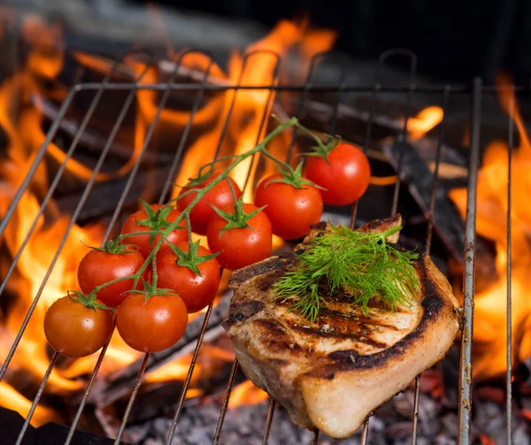 Stake grill and tomatoe