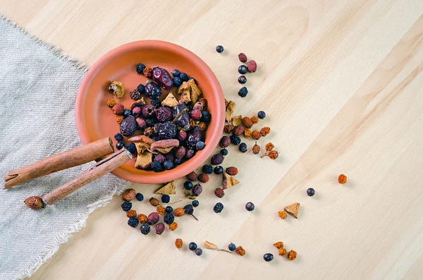 Dried berries in a clay bowl — Stock Photo, Image