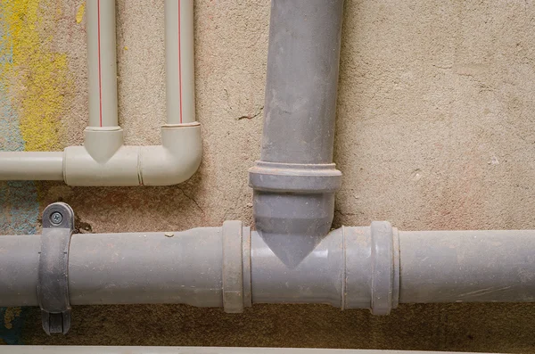 Mount pipes on wall — Stock Photo, Image