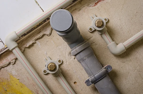 Mount pipes on wall — Stock Photo, Image