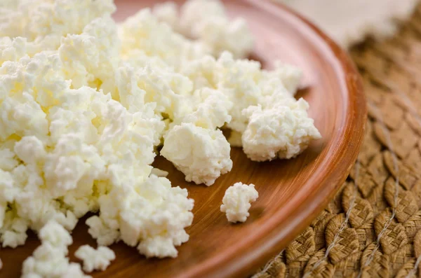 Curds on the brown plate — Stock Photo, Image