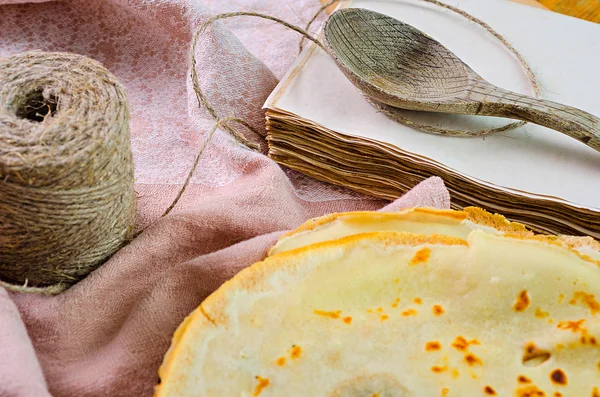 Pancakes on plate with spoon — Stock Photo, Image