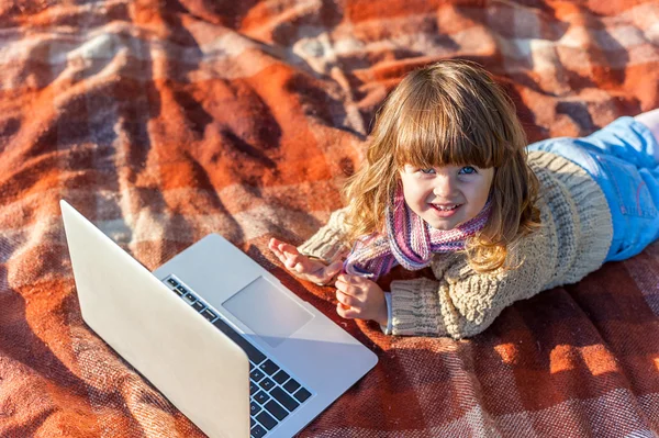 Girl playing on laptop — Stock Photo, Image