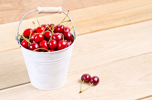 Ripe cherries in bucket — Stock Photo, Image