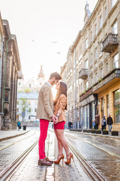 couple posing on streets of Europe