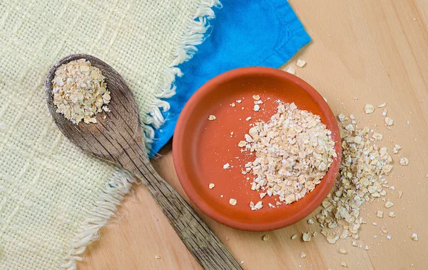 Raw oatmeal in  bowl — Stock Photo, Image