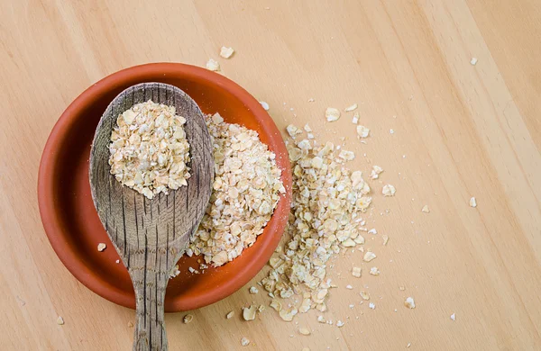 Raw oatmeal in  bowl — Stock Photo, Image