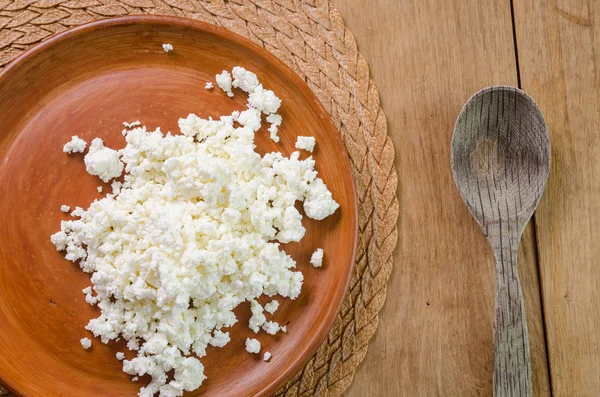Curds on the brown plate — Stock Photo, Image