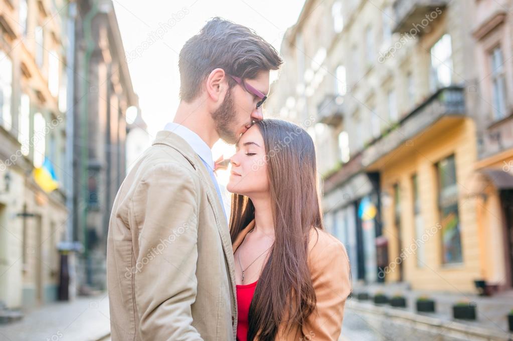 couple posing on streets of Europe
