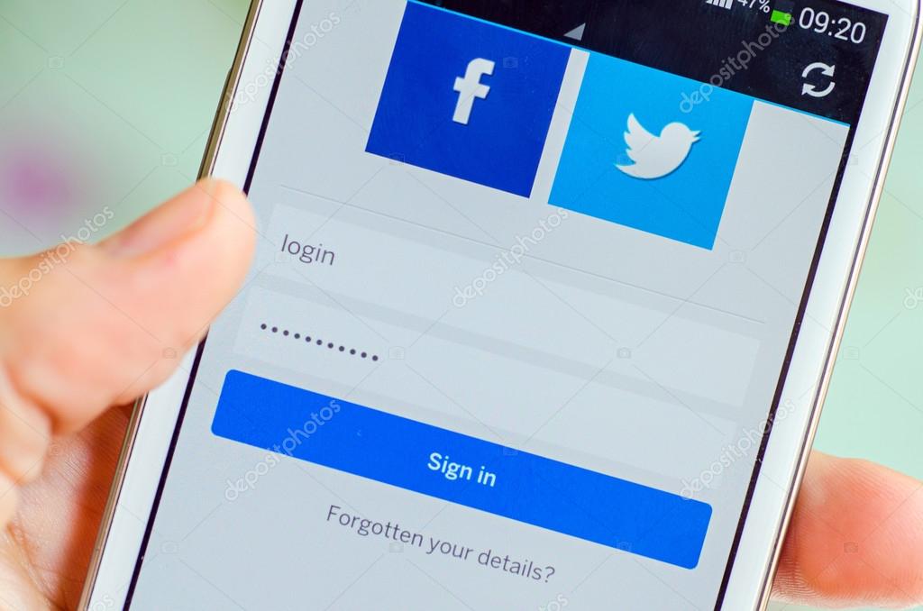 LVIV, UKRAINE - May 19, 2015: hand holding white Samsung Galaxy Smart Phone with MySpace social network Log In Screen with Facebok and Twitter icon