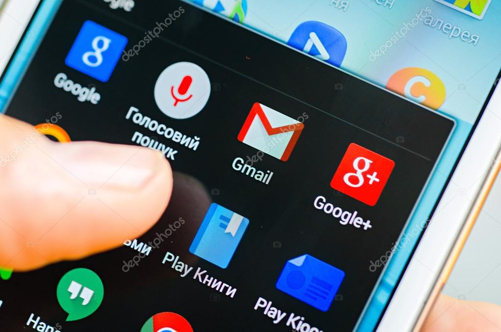 LVIV, UKRAINE - May 19, 2015: Hand holding white Samsung Smart Phone with Google application