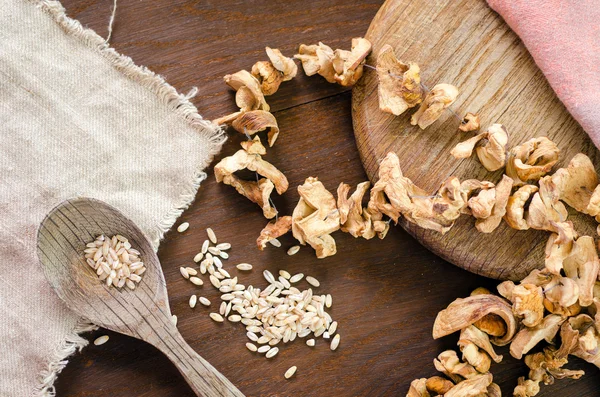 Dry mushrooms on wood table — Stock Photo, Image