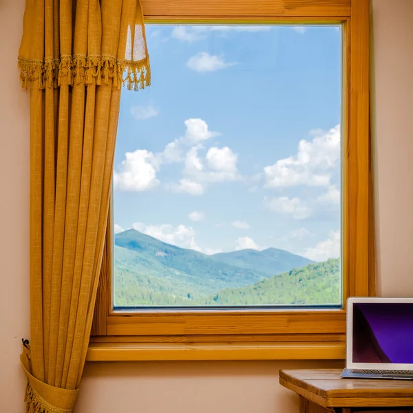 Modern laptop and window — Stock Photo, Image