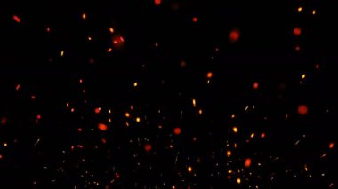 Yangın kıvılcımları Ağır Hareket 'i kaplıyor. Siyah renkte parlayan kıvılcımlar