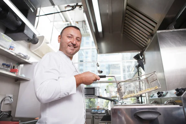 Low Angle Shot Cheerful Male Chef Smiling Camera While Making Royalty Free Stock Images