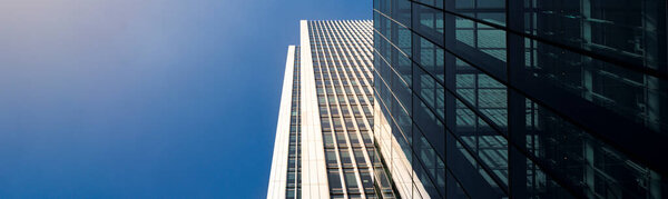 Modern city building architecture with glass fronts on a clear day in London, England panoramic
