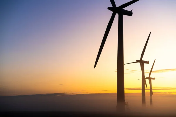 Three Commercial Wind Turbines Thick Fog Sunrise English Countryside —  Fotos de Stock