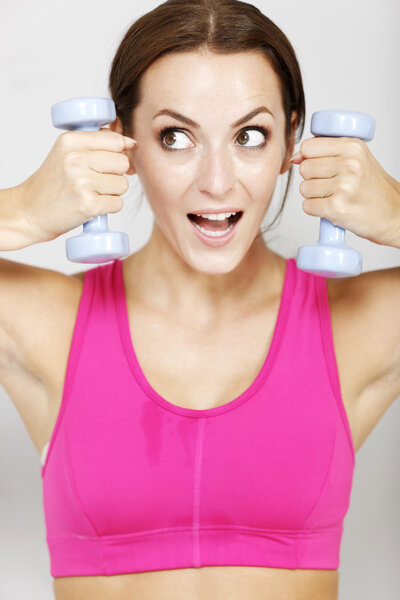 Woman using gym weights