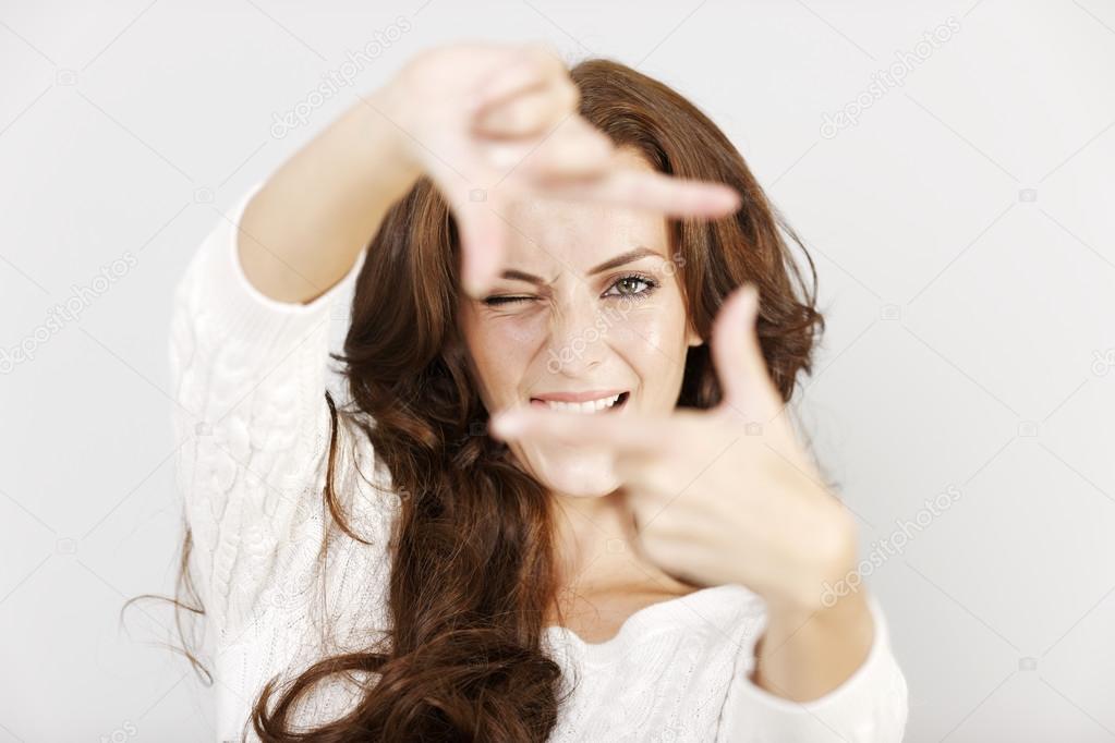 Woman using hands to frame