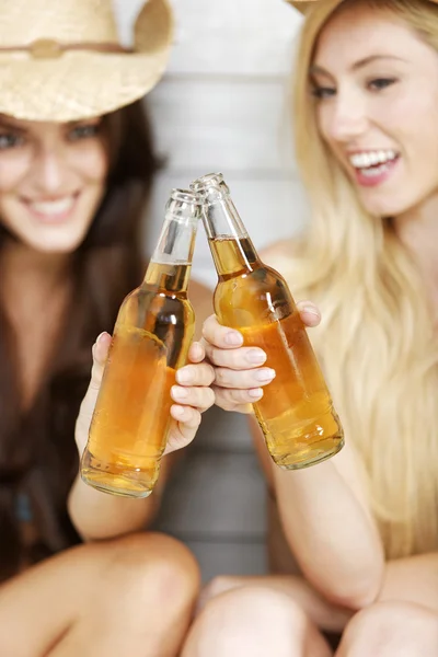 Two friends in beachwear and hats — Stock Photo, Image