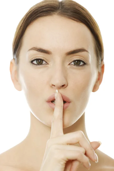 Woman holding her finger over her lips — Stock Photo, Image