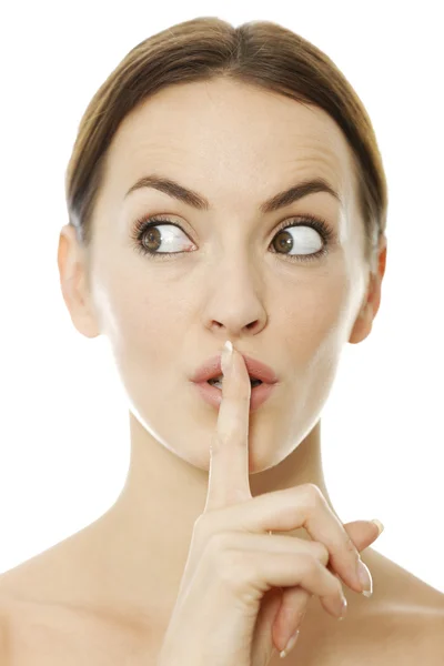 Woman holding her finger over her lips — Stock Photo, Image