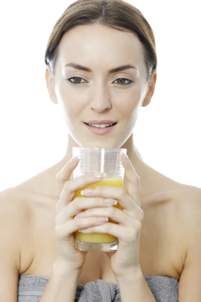 Woman holding a glass of Orange juice — Stock Photo, Image